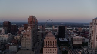 DX0001_000876 - 5.7K aerial stock footage stationary view of the Arch at twilight before flying away, Downtown St. Louis, Missouri