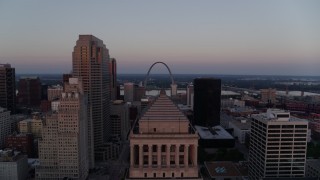 DX0001_000877 - 5.7K aerial stock footage ascend over courthouse to reveal the Gateway Arch at twilight, Downtown St. Louis, Missouri