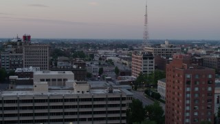DX0001_000879 - 5.7K aerial stock footage flyby brick office building for a wider view of neighborhood at twilight, Downtown St. Louis, Missouri