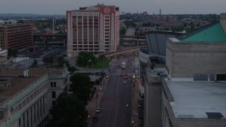 DX0001_000881 - 5.7K aerial stock footage light street traffic between hotel and arena at twilight, Downtown St. Louis, Missouri