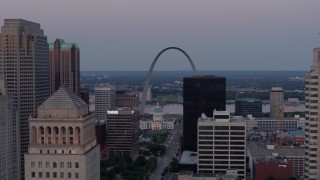 DX0001_000891 - 5.7K aerial stock footage of the Gateway Arch at twilight seen across Downtown St. Louis, Missouri