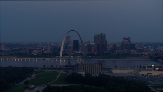 DX0001_000901 - 5.7K aerial stock footage view across the river of the the Gateway Arch at twilight, Downtown St. Louis, Missouri