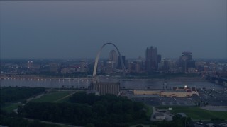 DX0001_000903 - 5.7K aerial stock footage looking across the Mississippi River at the Gateway Arch, Downtown St. Louis, Missouri, twilight