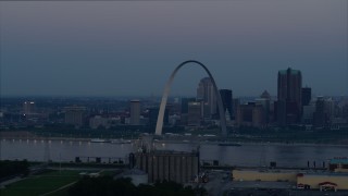 DX0001_000910 - 5.7K aerial stock footage of the famous Gateway Arch and Downtown St. Louis, Missouri, skyline at twilight