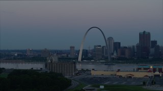 DX0001_000915 - 5.7K aerial stock footage of passing the Gateway Arch and the skyline of Downtown St. Louis, Missouri, at twilight