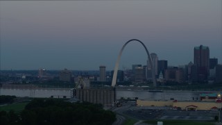 DX0001_000916 - 5.7K aerial stock footage of the Gateway Arch and the skyline of Downtown St. Louis, Missouri, at twilight