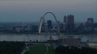 DX0001_000921 - 5.7K aerial stock footage of the Gateway Arch and the skyline of Downtown St. Louis, Missouri, across the river at sunrise