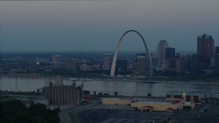 DX0001_000923 - 5.7K aerial stock footage of the Gateway Arch and Downtown St. Louis, Missouri, across the Mississippi River at sunrise