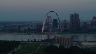 DX0001_000924 - 5.7K aerial stock footage of the Gateway Arch and Downtown St. Louis, Missouri, beside the Mississippi River at sunrise