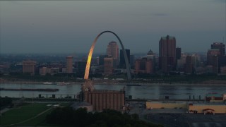DX0001_000931 - 5.7K aerial stock footage of sunlight reflected off the Gateway Arch in Downtown St. Louis, Missouri, at sunrise