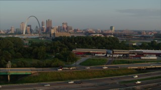 DX0001_000957 - 5.7K aerial stock footage pan across I-55 to reveal the Gateway Arch in the morning, Downtown St. Louis, Missouri