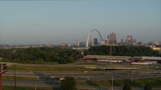 DX0001_000966 - 5.7K aerial stock footage ascend for a view of the Gateway Arch from East St. Louis in the morning, Downtown St. Louis, Missouri