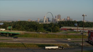 DX0001_000970 - 5.7K aerial stock footage ascend from light traffic on I-55 for view of the Gateway Arch at sunrise, Downtown St. Louis, Missouri