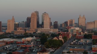 DX0001_000995 - 5.7K stock footage aerial video of flying by the city skyline at sunrise, Downtown Kansas City, Missouri