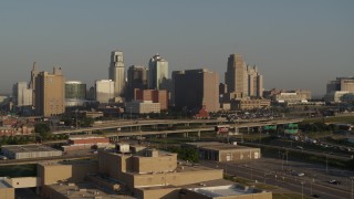 DX0001_001020 - 5.7K aerial stock footage approach the downtown skyline and Hwy 71 at sunrise, Downtown Kansas City, Missouri