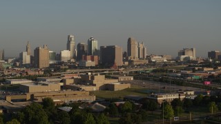 DX0001_001022 - 5.7K aerial stock footage reverse view of the downtown skyline at sunrise, Downtown Kansas City, Missouri
