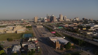 DX0001_001030 - 5.7K aerial stock footage of flyby of the city skyline seen while flying near I-70 in Downtown Kansas City, Missouri