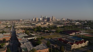 DX0001_001032 - 5.7K aerial stock footage of a reverse view of the city skyline, reveal community center in Downtown Kansas City, Missouri