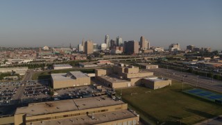 DX0001_001034 - 5.7K aerial stock footage of approaching tech school and the city skyline of Downtown Kansas City, Missouri
