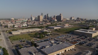 DX0001_001041 - 5.7K aerial stock footage reverse view of freeway and city skyline in Downtown Kansas City, Missouri