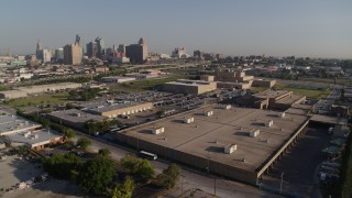 DX0001_001044 - 5.7K aerial stock footage fly away from adult education buildings to reveal skyline of Downtown Kansas City, Missouri