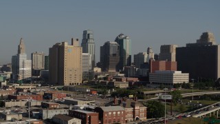 DX0001_001051 - 5.7K aerial stock footage passing a city office building and skyscrapers in Downtown Kansas City, Missouri