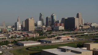 DX0001_001057 - 5.7K aerial stock footage of a view of the city's skyline from east of the freeway in Downtown Kansas City, Missouri