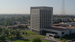 DX0001_001065 - 5.7K aerial stock footage of orbiting around an office building in Kansas City, Missouri