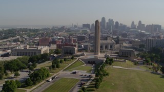 DX0001_001066 - 5.7K aerial stock footage of orbiting WWI memorial, downtown skyline in background, in Kansas City, Missouri