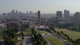 DX0001_001068 - 5.7K aerial stock footage orbit the WWI memorial in Kansas City, Missouri, with a view of the downtown skyline