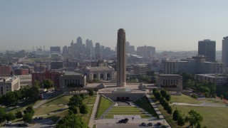 DX0001_001072 - 5.7K aerial stock footage reverse view of the WWI memorial in Kansas City, Missouri, and the downtown skyline