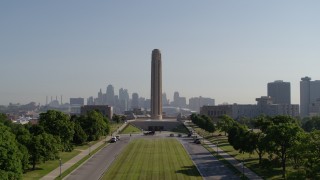 DX0001_001073 - 5.7K aerial stock footage fly low and ascend toward the WWI memorial in Kansas City, Missouri, and the downtown skyline