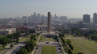 DX0001_001082 - 5.7K aerial stock footage a static view of the WWI memorial and skyline in Kansas City, Missouri, then descend