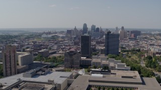 DX0001_001085 - 5.7K aerial stock footage of the city skyline behind Crown Center office buildings, Downtown Kansas City, Missouri