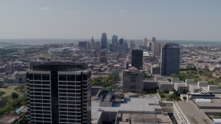 DX0001_001086 - 5.7K aerial stock footage of the city skyline behind tall Crown Center office buildings, Downtown Kansas City, Missouri