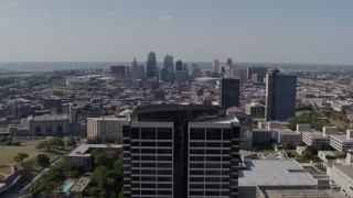 DX0001_001089 - 5.7K aerial stock footage slow approach to skyline behind Crown Center office building, Downtown Kansas City, Missouri