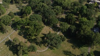 DX0001_001092 - 5.7K aerial stock footage of orbiting a cemetery in Kansas City, Missouri
