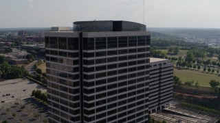 DX0001_001095 - 5.7K aerial stock footage of orbiting the top of a Crown Center office building in Kansas City, Missouri