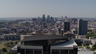 DX0001_001098 - 5.7K aerial stock footage fly over Crown Center office building and reveal skyline of Downtown Kansas City, Missouri