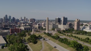 DX0001_001106 - 5.7K aerial stock footage of the WWI memorial, the Downtown Kansas City, Missouri skyline, and Crown Center