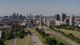 DX0001_001107 - 5.7K aerial stock footage orbit the WWI memorial, with view of Downtown Kansas City, Missouri skyline, and Crown Center