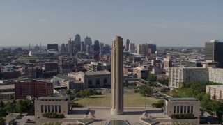 DX0001_001109 - 5.7K aerial stock footage fly away from the WWI memorial and the Downtown Kansas City, Missouri skyline