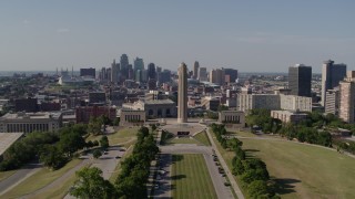 DX0001_001110 - 5.7K aerial stock footage static view and slow approach to the WWI memorial and Downtown Kansas City, Missouri skyline