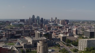 DX0001_001112 - 5.7K aerial stock footage fly over the WWI memorial to approach the Downtown Kansas City, Missouri skyline