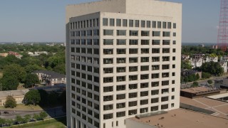 DX0001_001117 - 5.7K aerial stock footage orbit and fly away from a government office building in Kansas City, Missouri