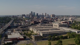 DX0001_001121 - 5.7K aerial stock footage reverse view of a government office building and city skyline, Downtown Kansas City, Missouri