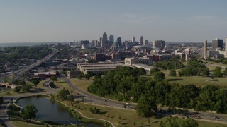 DX0001_001122 - 5.7K aerial stock footage fly away from a government office building and city skyline, Downtown Kansas City, Missouri