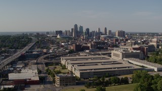 DX0001_001130 - 5.7K aerial stock footage of flying away from a government building and city's skyline, Downtown Kansas City, Missouri
