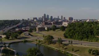 DX0001_001132 - 5.7K aerial stock footage ascend for view of a government building and city's skyline, Downtown Kansas City, Missouri
