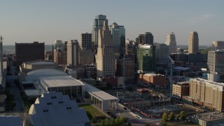 DX0001_001154 - 5.7K aerial stock footage of descending with view of tall skyscrapers in Downtown Kansas City, Missouri